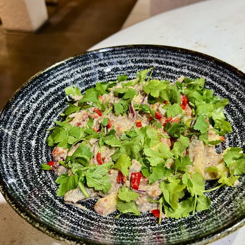 Akekili salad of baked vegetables with nut paste and cilantro