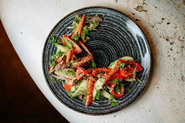 Tbilisi salad from fresh vegetables with nut paste